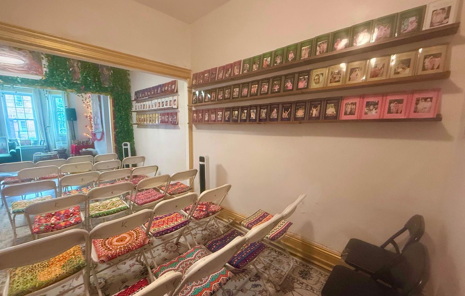 A wall of Srila Gurudeva's published books at the Queens center